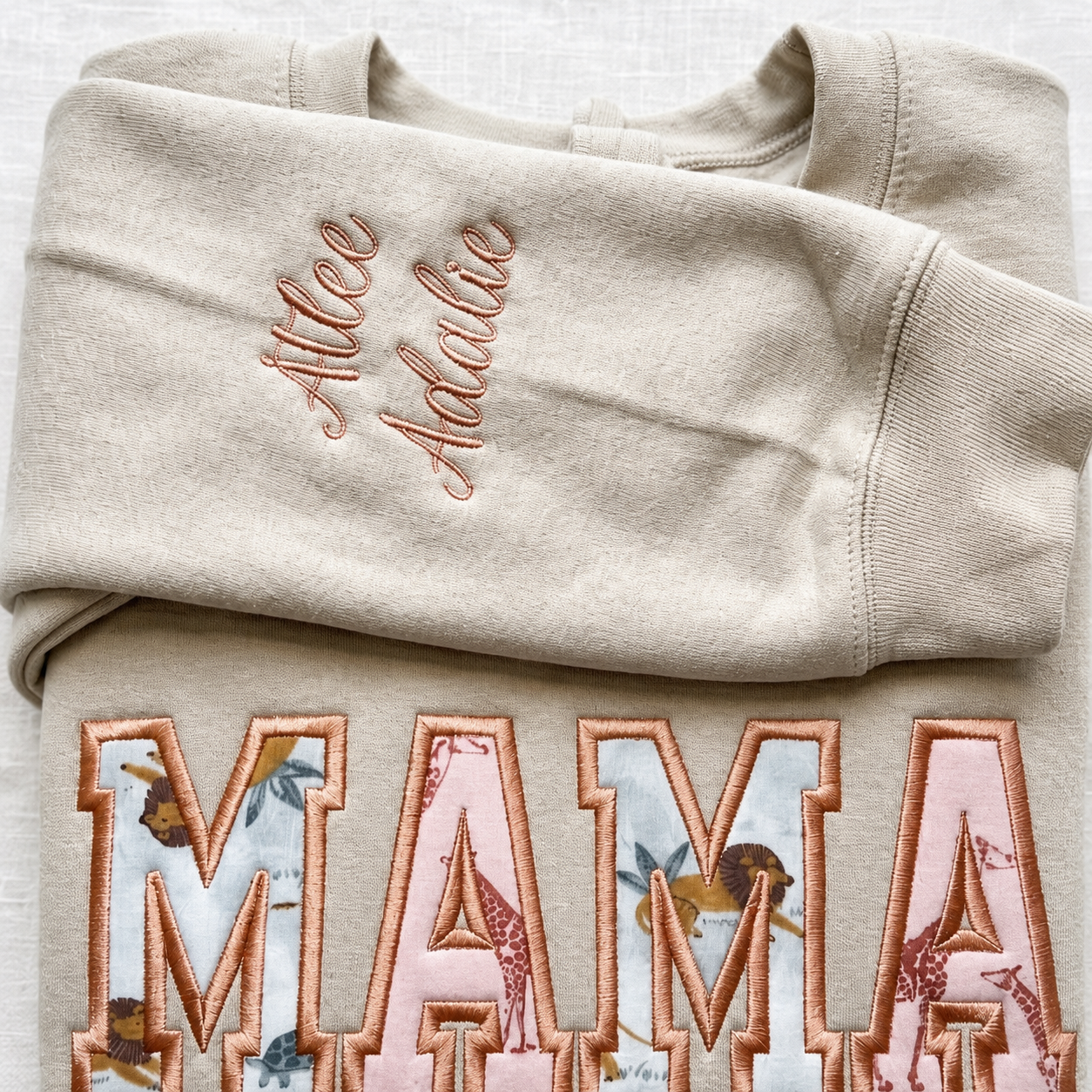 Personalized embroidered multiple names on a keepsake sweatshirt sleeve